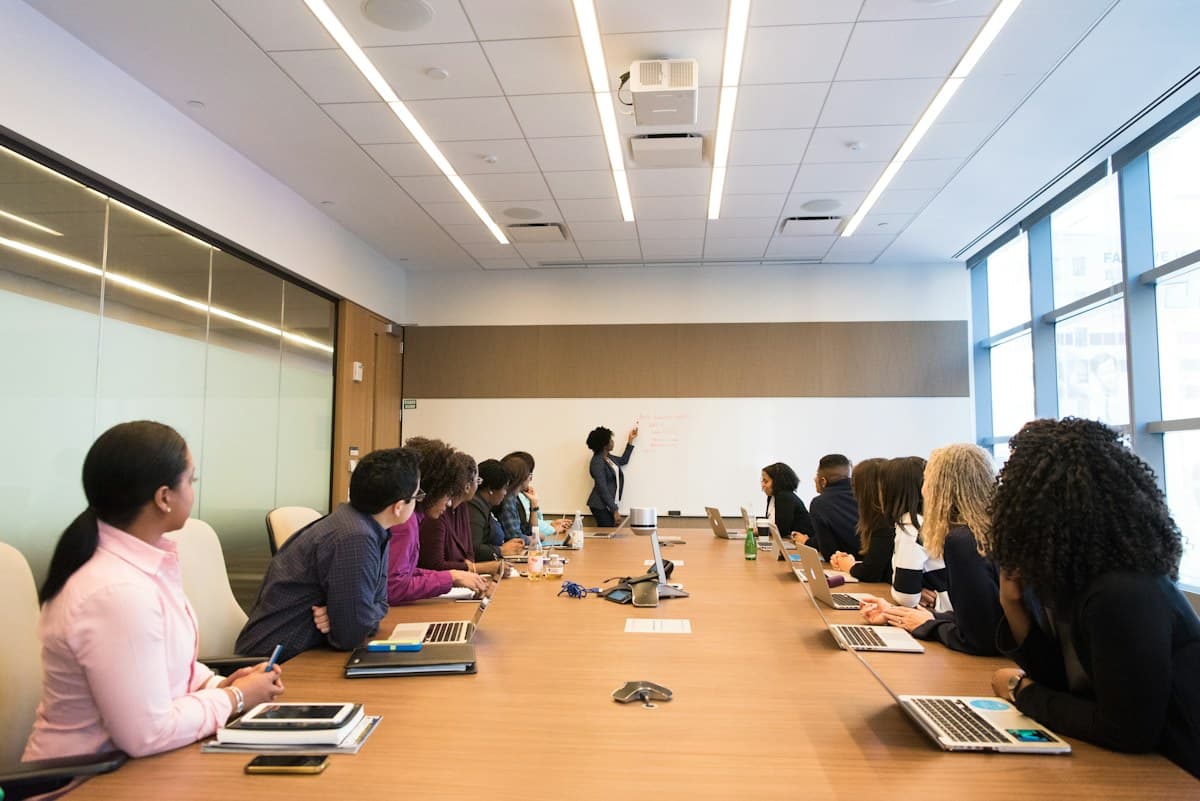 African colleagues sharing ideas around a boardroom table